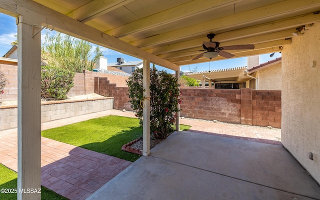 view of patio / terrace with a fenced backyard and ceiling fan