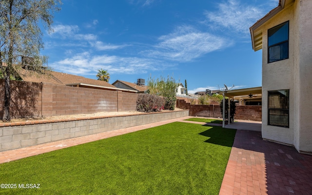 view of yard with a patio area and a fenced backyard