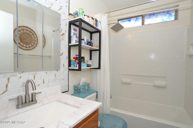 full bathroom featuring toilet, vanity, shower / bath combination with curtain, and tasteful backsplash