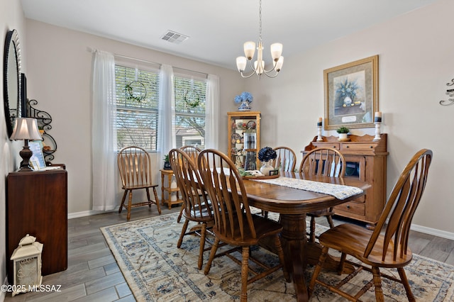 dining space featuring an inviting chandelier