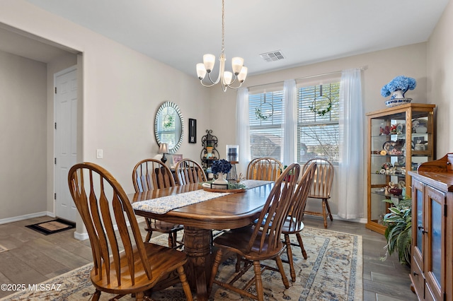 dining space with a notable chandelier