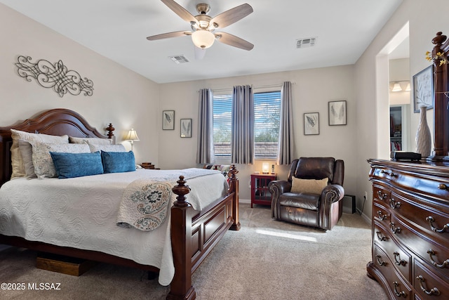 bedroom featuring light colored carpet and ceiling fan