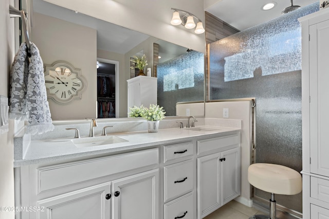 bathroom featuring tile patterned flooring and vanity