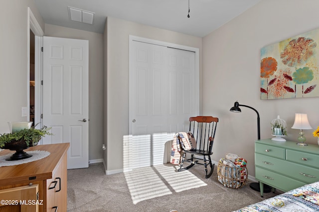 carpeted bedroom featuring a closet