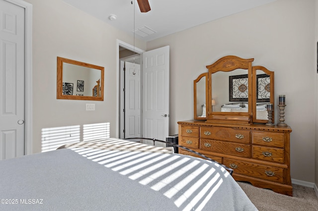 bedroom with ceiling fan and carpet flooring