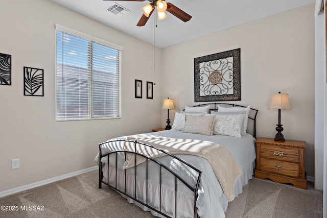 bedroom with ceiling fan and light colored carpet