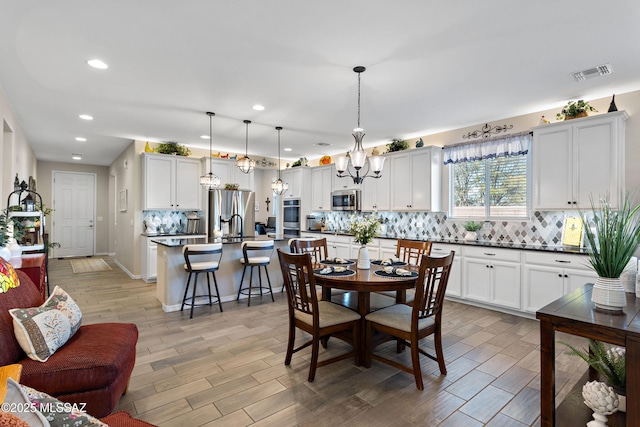 dining room featuring a notable chandelier