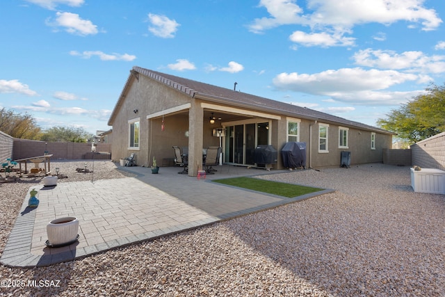 back of house with a patio area