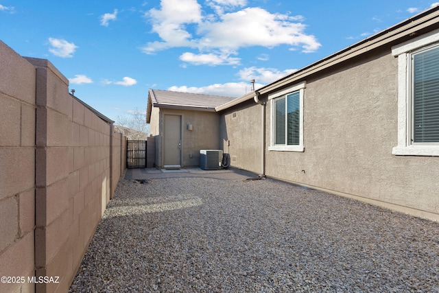 exterior space featuring a patio area and central air condition unit