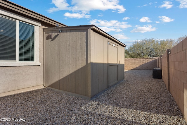 view of home's exterior featuring a shed