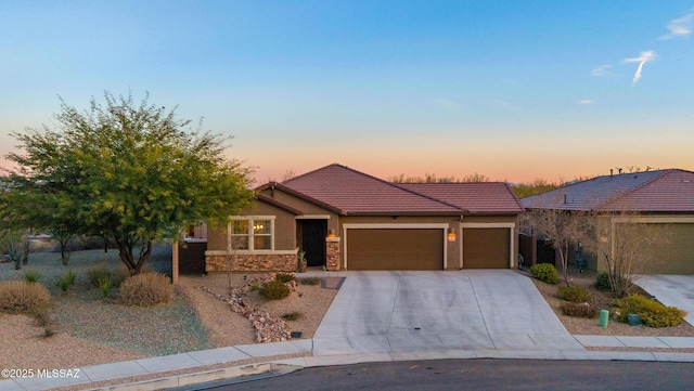 view of front of property with a garage