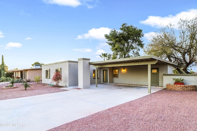 view of front of home featuring a carport