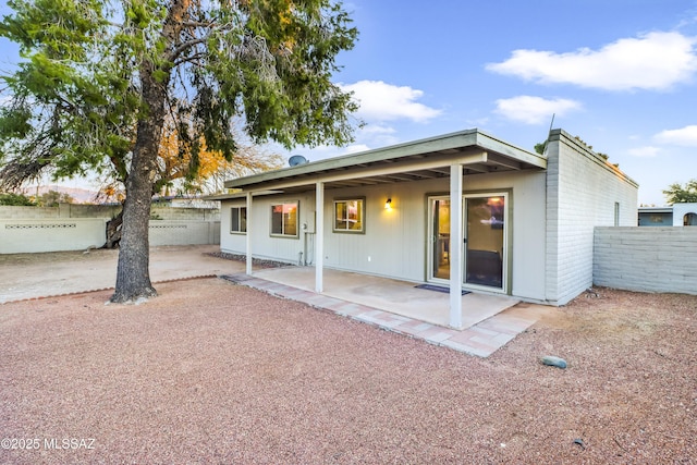 rear view of property featuring a patio