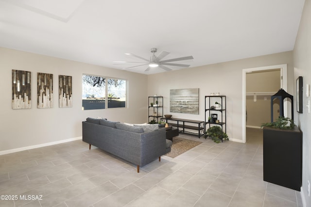 living room with ceiling fan and light tile patterned floors