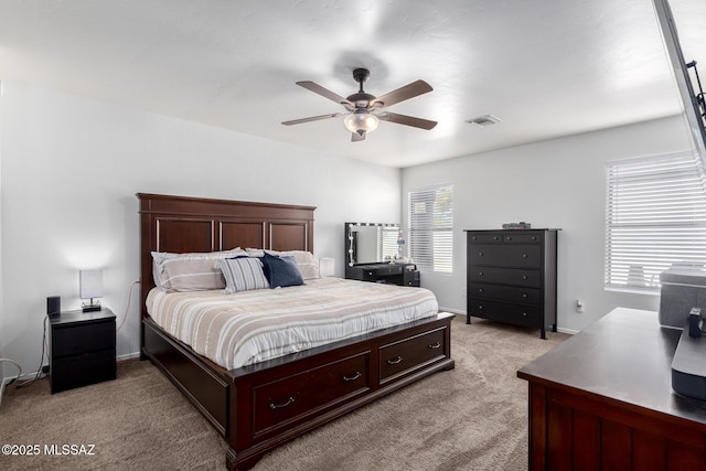 bedroom featuring ceiling fan and light colored carpet