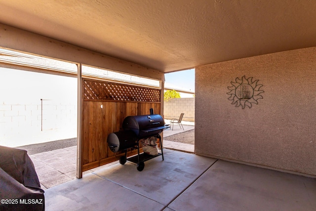 view of patio featuring a grill