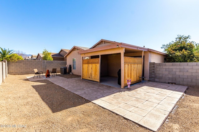 back of house featuring a patio and central air condition unit