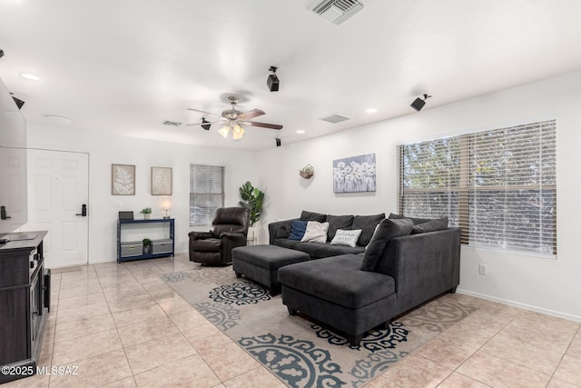 living room with light tile patterned floors and ceiling fan