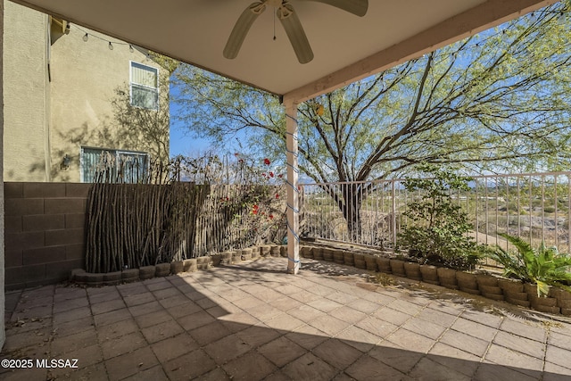 view of patio featuring a fenced backyard and ceiling fan