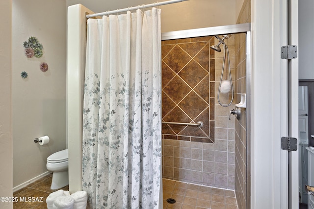 bathroom with toilet, a shower with shower curtain, and tile patterned flooring