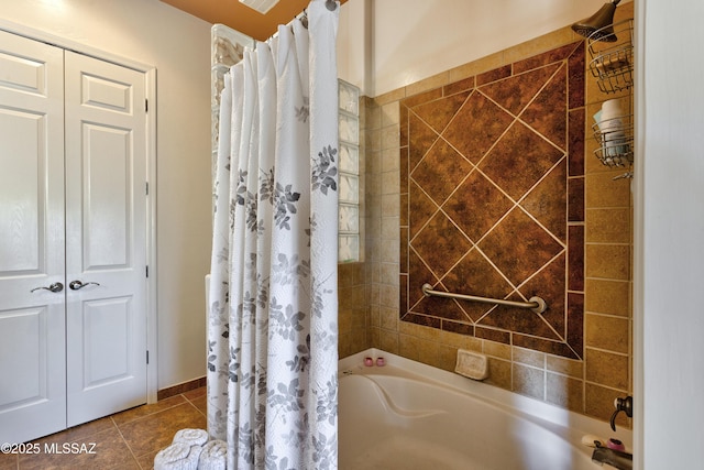 bathroom with tile patterned floors and shower / bath combo
