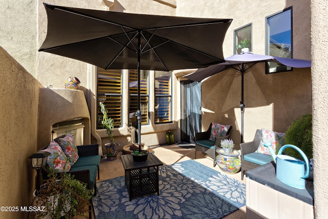 view of patio / terrace featuring a balcony and outdoor lounge area
