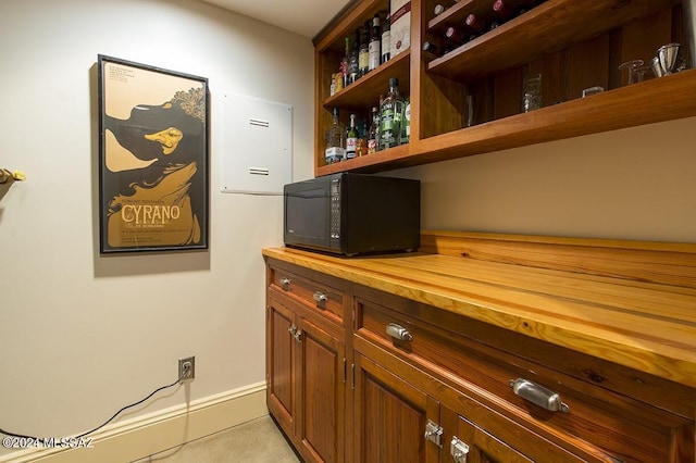 bar featuring butcher block counters