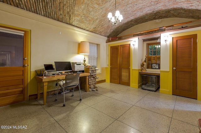 office space featuring lofted ceiling, brick ceiling, and an inviting chandelier