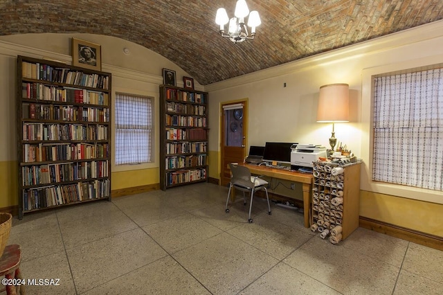 office with a notable chandelier, lofted ceiling, and brick ceiling