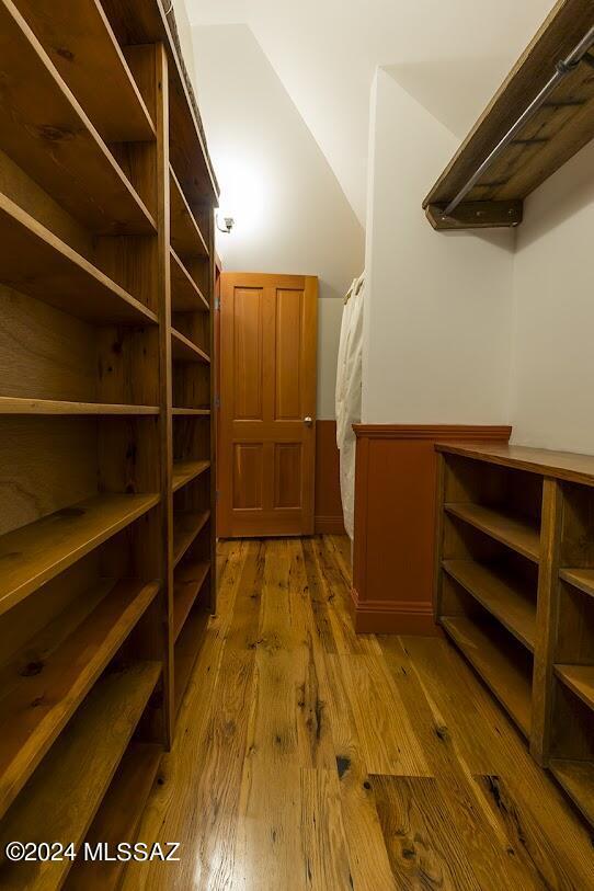 walk in closet featuring hardwood / wood-style floors