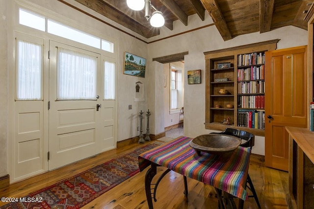 sitting room with lofted ceiling with beams, wood ceiling, and dark hardwood / wood-style floors