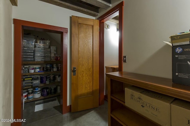 corridor with lofted ceiling