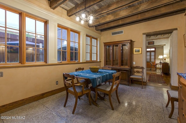 dining area with beam ceiling, wood ceiling, and an inviting chandelier