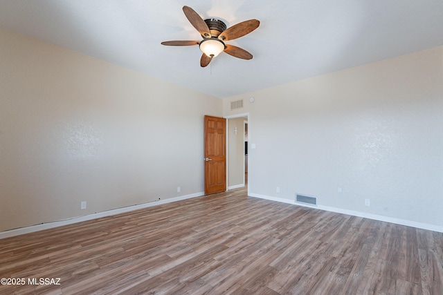 spare room featuring ceiling fan and hardwood / wood-style floors