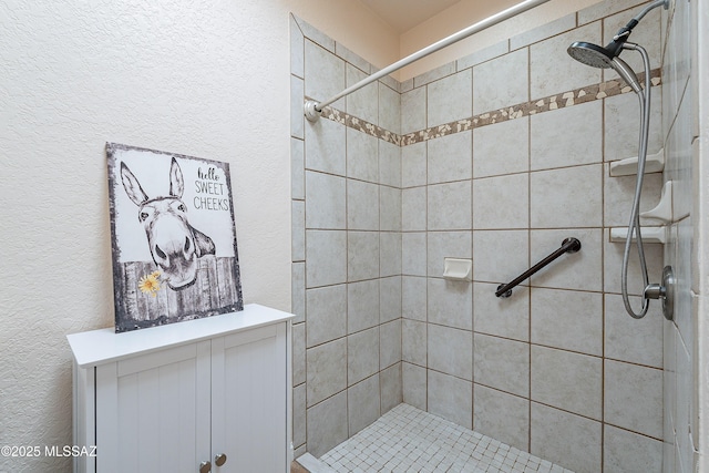 bathroom featuring a tile shower