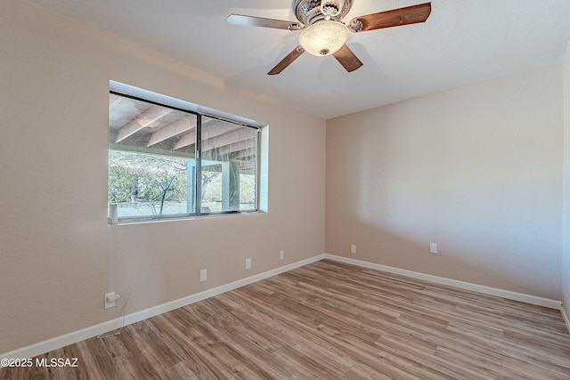 spare room featuring ceiling fan and light hardwood / wood-style flooring