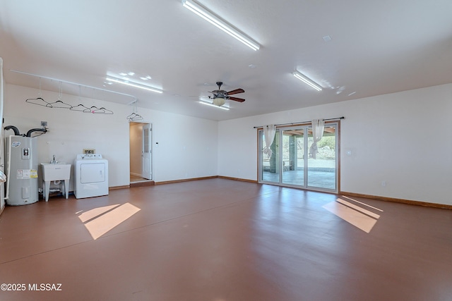 garage featuring ceiling fan, washer / dryer, sink, and water heater