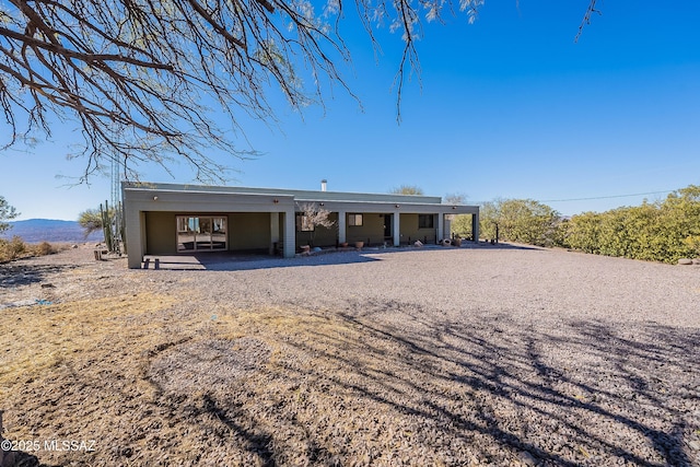 view of front of property with a carport