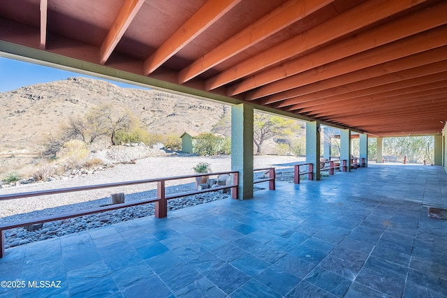 view of patio / terrace with a mountain view