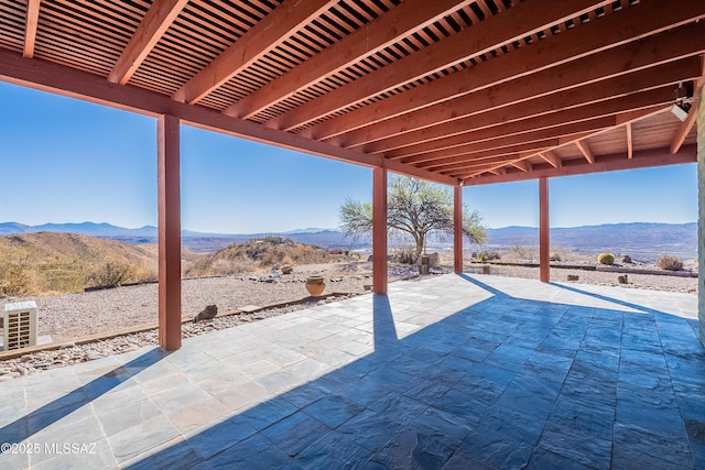 view of patio / terrace featuring a mountain view