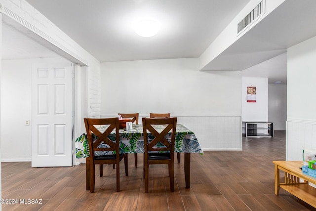 dining area with dark hardwood / wood-style floors