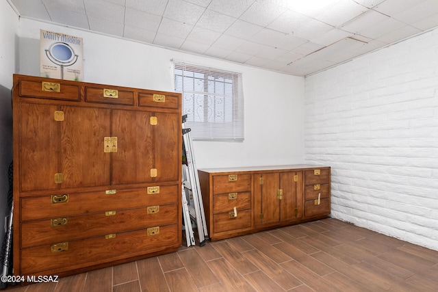 interior space featuring brick wall