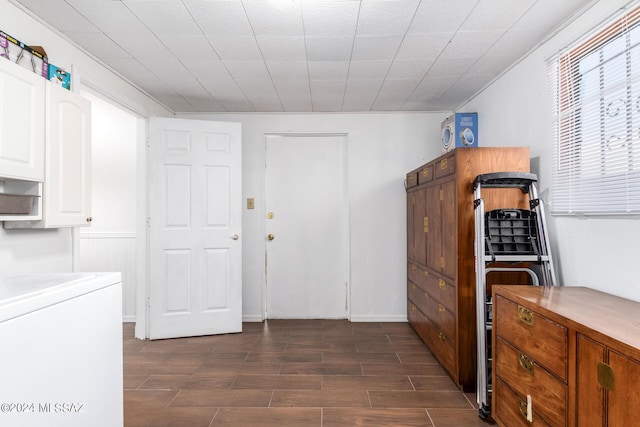 laundry room featuring washer / clothes dryer and cabinets