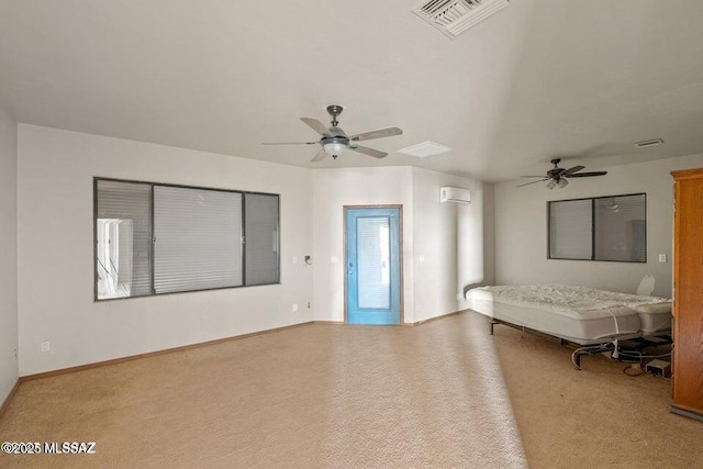 unfurnished bedroom featuring a wall mounted air conditioner, ceiling fan, and light colored carpet