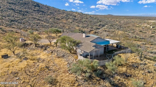 birds eye view of property with a mountain view