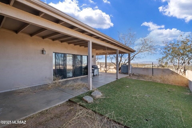 view of yard featuring a patio area and cooling unit