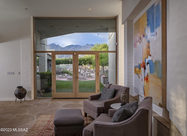 interior space with a mountain view and french doors