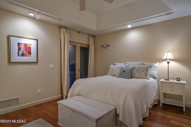 bedroom with hardwood / wood-style flooring and ceiling fan