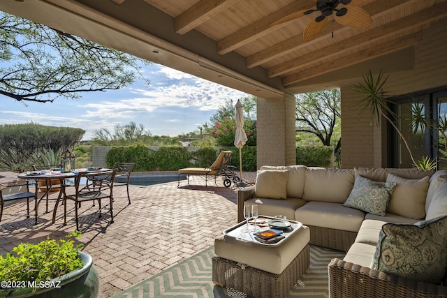 view of patio with a swimming pool, an outdoor hangout area, and ceiling fan