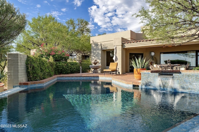 view of pool featuring a patio